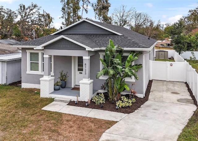 view of front of property with a front yard and a porch