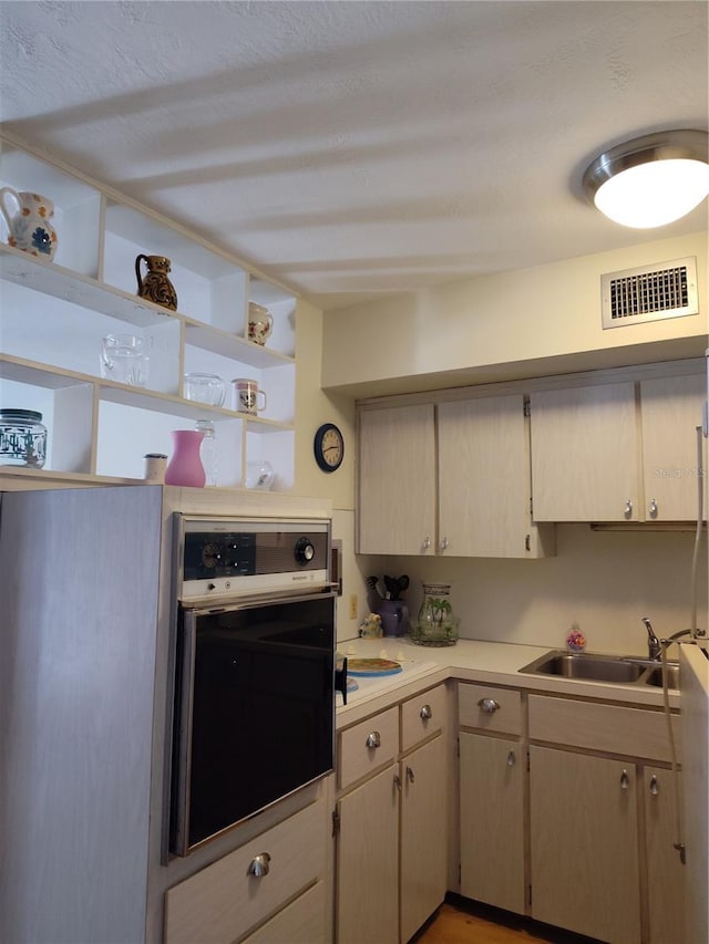 kitchen featuring sink and stainless steel oven