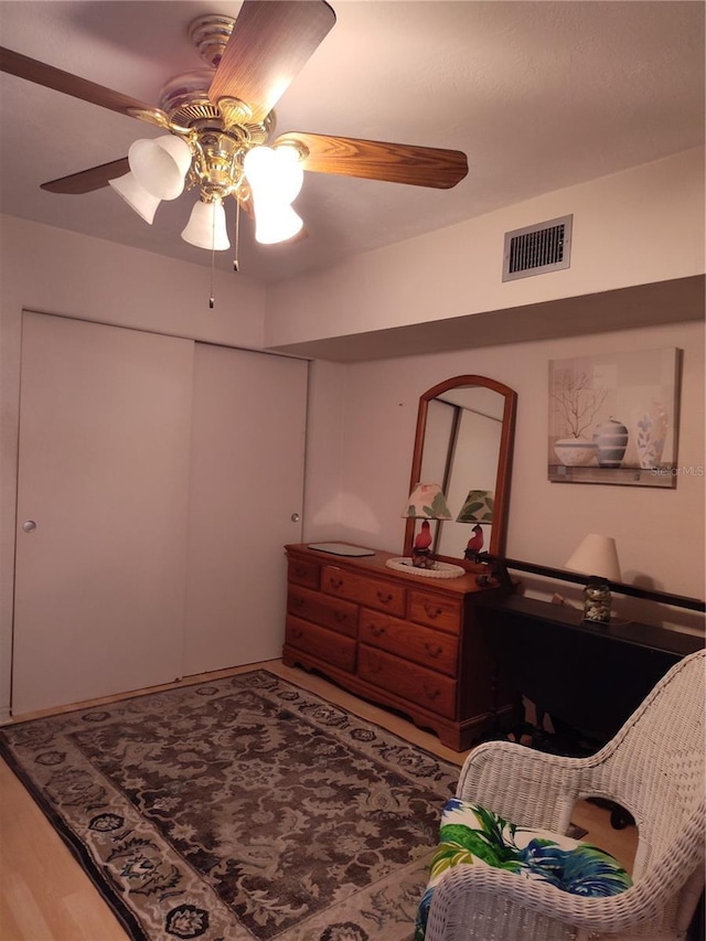 bedroom with hardwood / wood-style flooring and ceiling fan