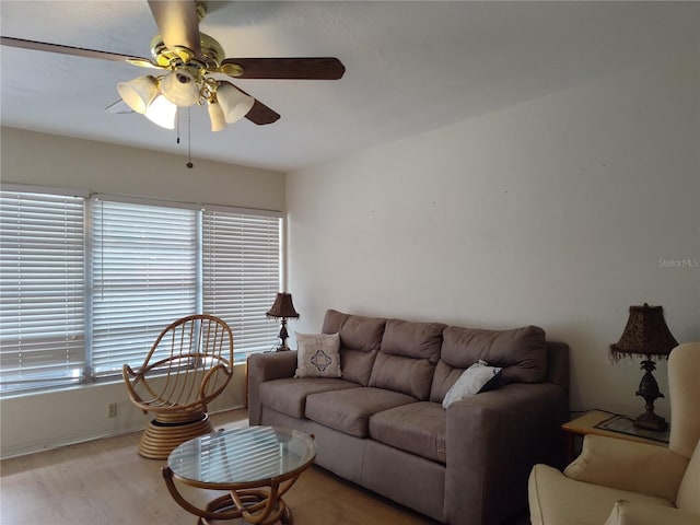 living room with ceiling fan, hardwood / wood-style flooring, and a healthy amount of sunlight