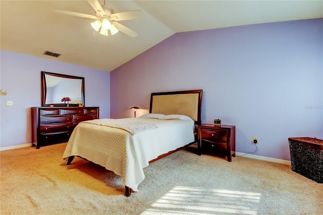 carpeted bedroom with vaulted ceiling and ceiling fan