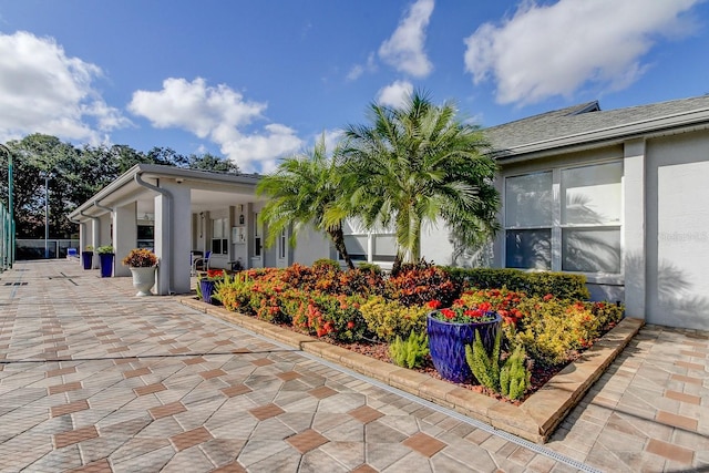 view of property exterior with stucco siding