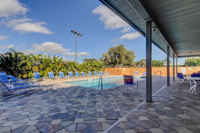 view of swimming pool with a patio