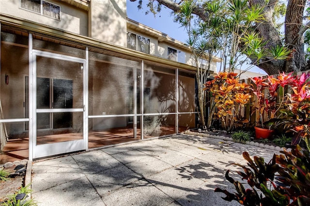 view of patio / terrace with a sunroom