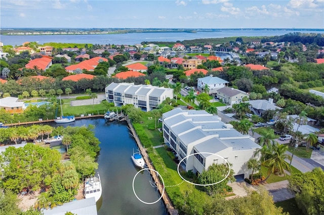 birds eye view of property with a water view