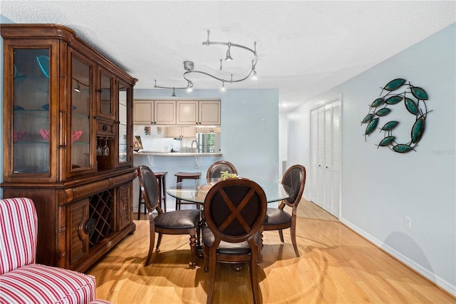 dining area with light wood-type flooring