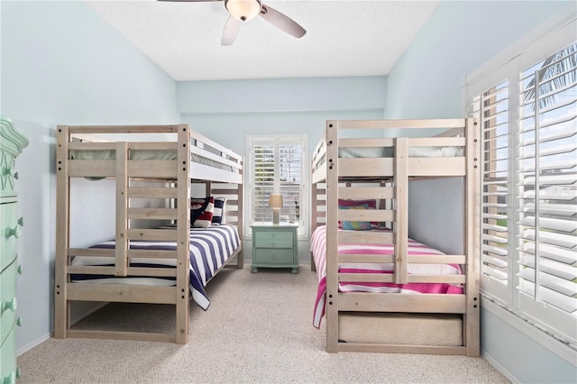 bedroom featuring ceiling fan and a textured ceiling