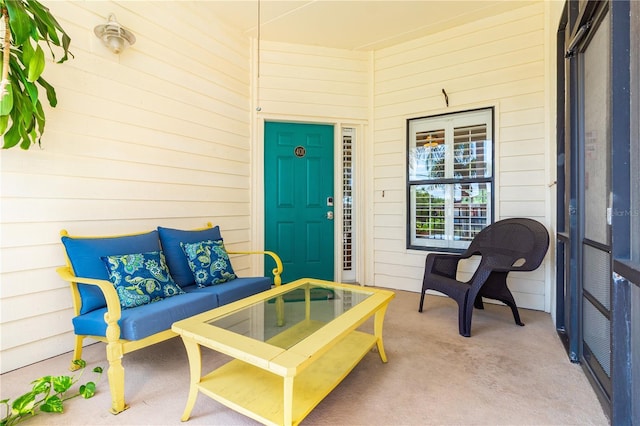 entrance to property featuring outdoor lounge area