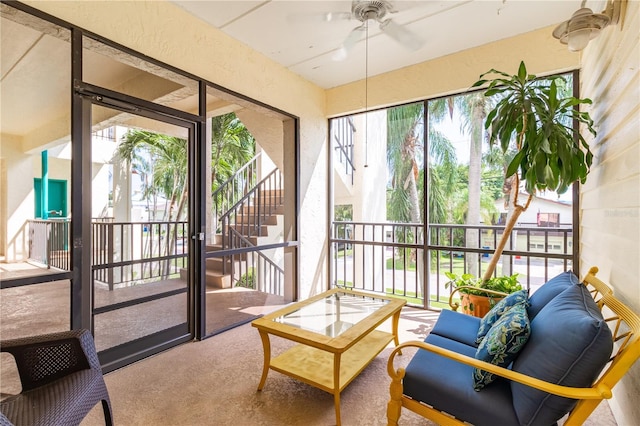 sunroom with ceiling fan and a wealth of natural light