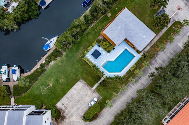 birds eye view of property with a water view