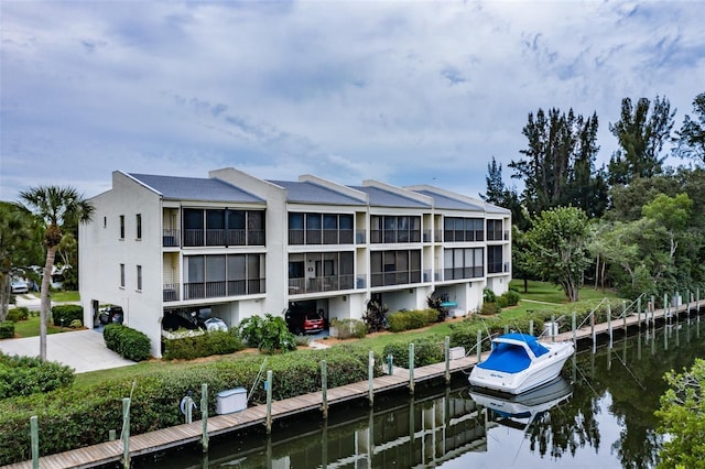 rear view of property featuring a water view