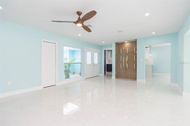 spare room featuring ceiling fan