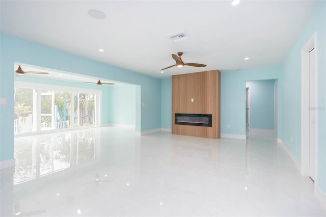 unfurnished living room featuring a fireplace and ceiling fan