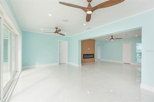 unfurnished room featuring ceiling fan, wooden ceiling, and a fireplace