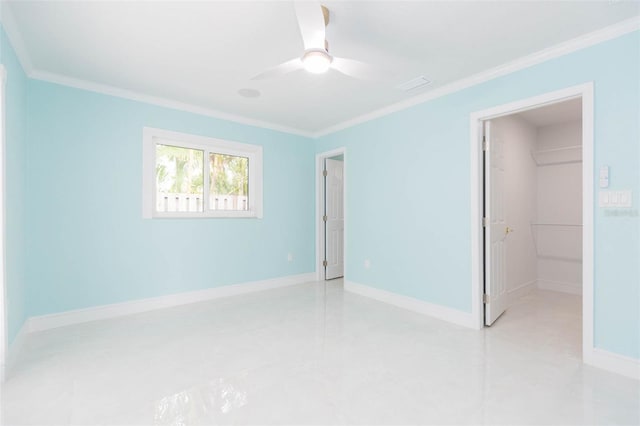 unfurnished room featuring ornamental molding and ceiling fan