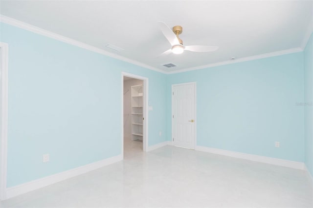 spare room with crown molding and ceiling fan