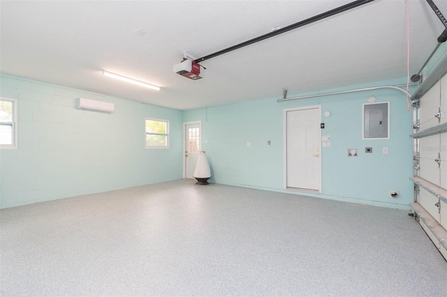 garage with a garage door opener, a wall mounted AC, and electric panel