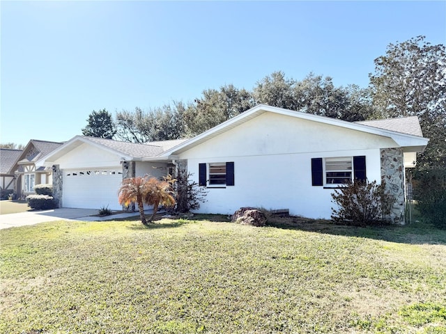 ranch-style house featuring a garage and a front lawn