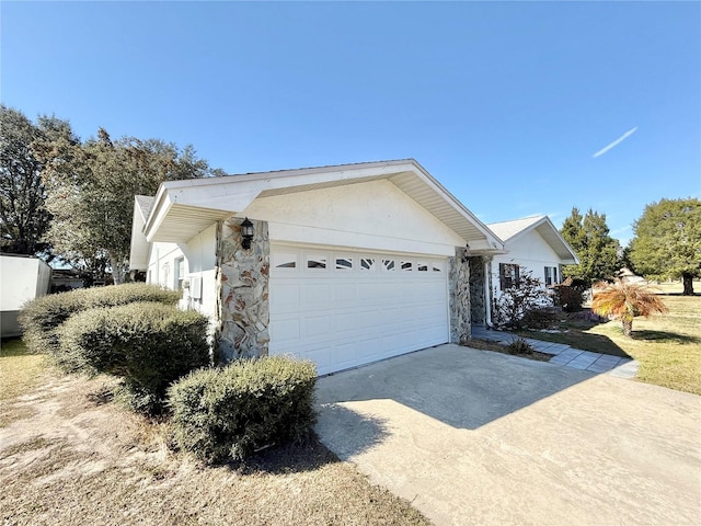 view of side of property featuring a garage