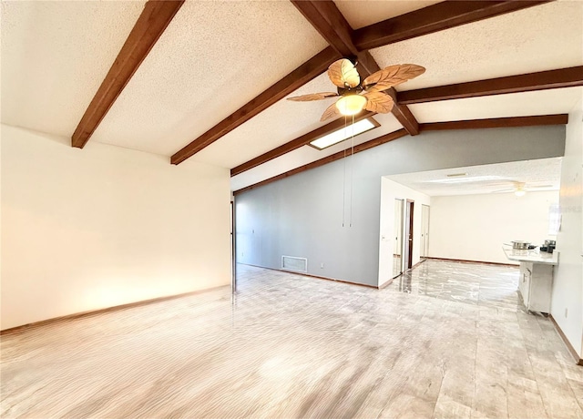 unfurnished living room featuring vaulted ceiling with beams, a textured ceiling, light hardwood / wood-style flooring, and ceiling fan