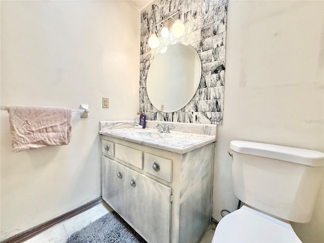 bathroom with tile patterned floors, vanity, and toilet