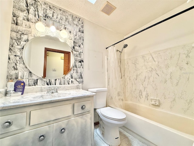 full bathroom with toilet, a textured ceiling, vanity, shower / bathtub combination with curtain, and tile patterned flooring