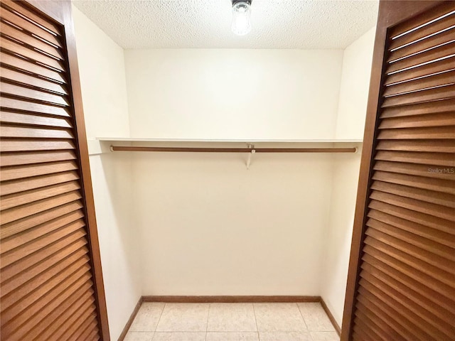 walk in closet featuring light tile patterned floors