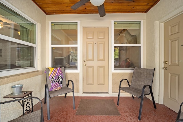 entrance to property with ceiling fan