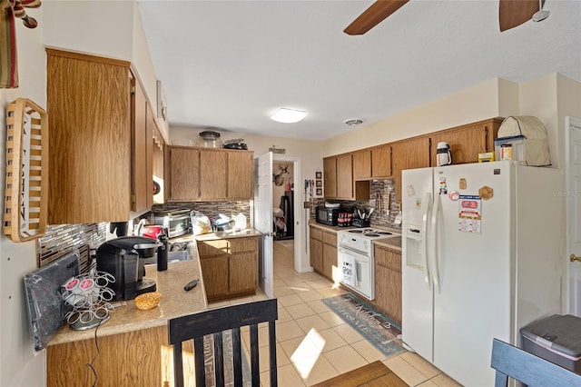 kitchen with white appliances, decorative backsplash, ceiling fan, and light tile patterned flooring