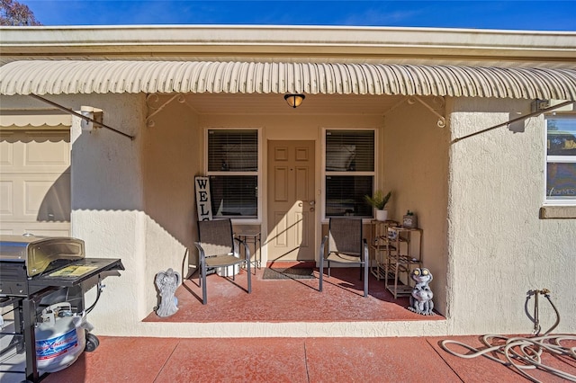 doorway to property featuring a patio