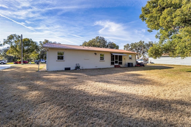 back of house with a yard