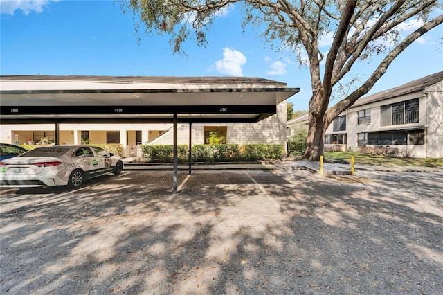 view of parking with a carport