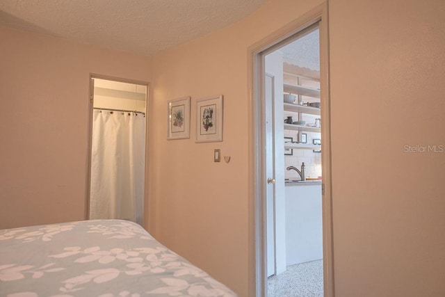 bedroom featuring a textured ceiling