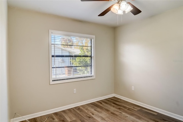 empty room featuring hardwood / wood-style flooring and ceiling fan