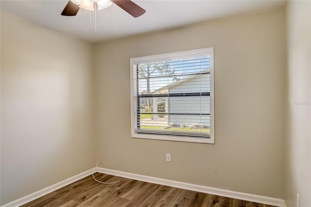 spare room with wood-type flooring and ceiling fan