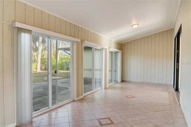 tiled empty room with crown molding