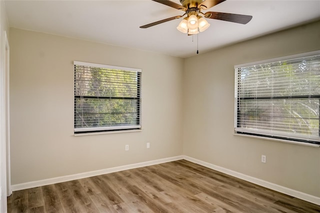 spare room featuring ceiling fan and wood-type flooring