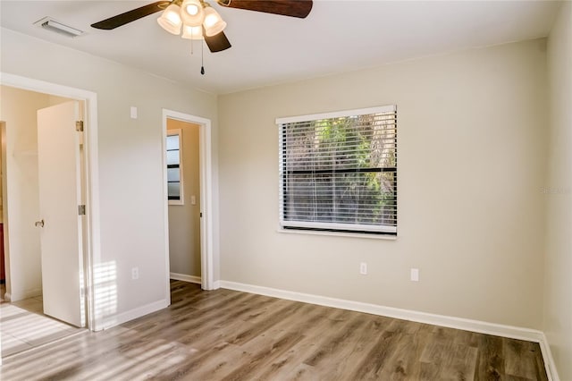 unfurnished bedroom with hardwood / wood-style floors and ceiling fan