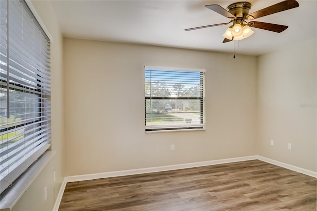 unfurnished room featuring hardwood / wood-style flooring and ceiling fan