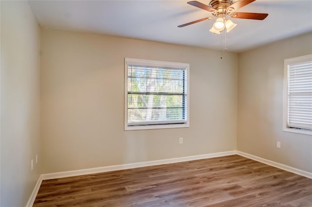 unfurnished room featuring ceiling fan and hardwood / wood-style floors