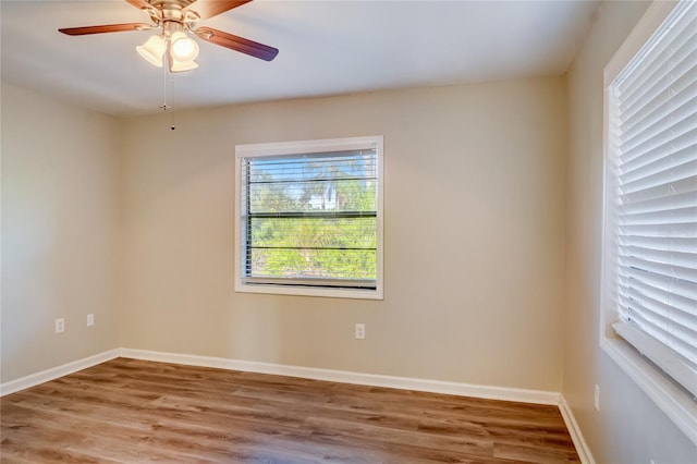 empty room featuring hardwood / wood-style floors and ceiling fan