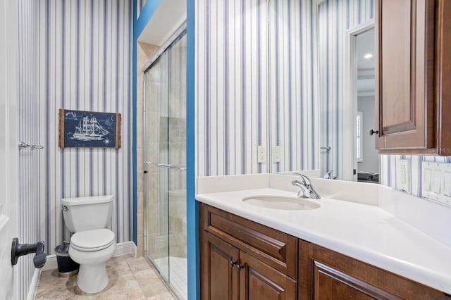 bathroom featuring vanity, toilet, tile patterned floors, and walk in shower