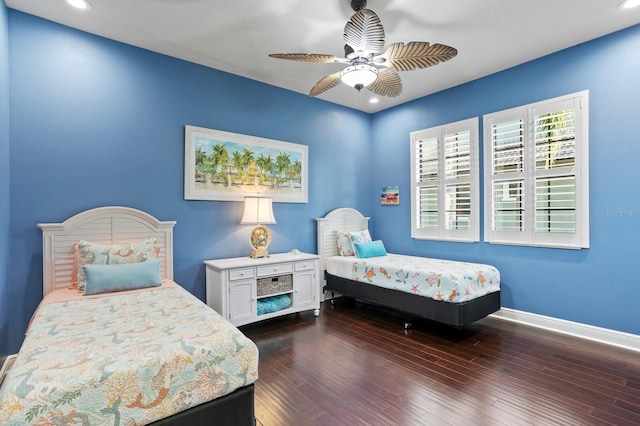 bedroom with dark wood-type flooring and ceiling fan