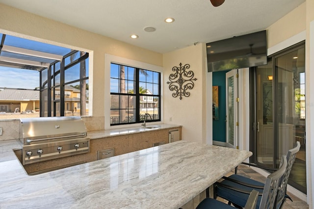 interior space featuring light stone countertops and kitchen peninsula