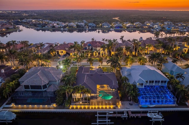 aerial view at dusk with a water view