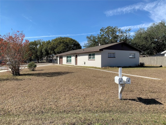 view of front of property with a front lawn