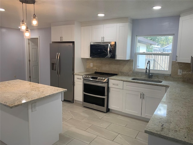 kitchen featuring sink, white cabinets, and appliances with stainless steel finishes