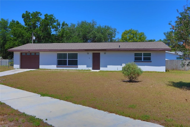 5729 13th St, Zephyrhills, FL 33542 - ranch-style house featuring a garage, driveway, and stucco siding