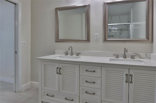 5729 13th St, Zephyrhills, FL 33542 - bathroom featuring double vanity and a shower with shower door