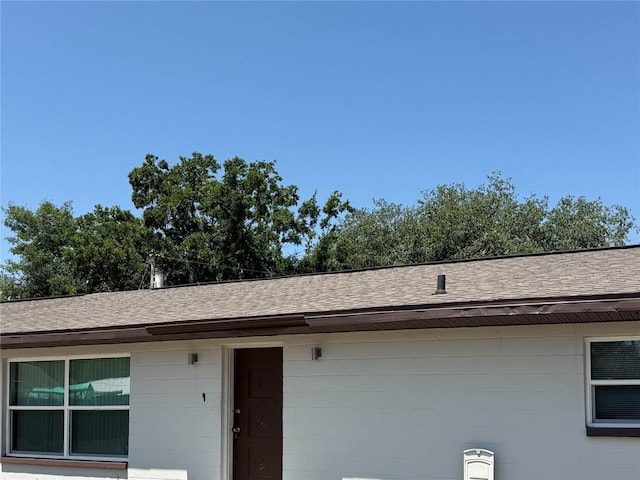 5729 13th St, Zephyrhills, FL 33542 - exterior view of concrete block siding and roof with shingles
